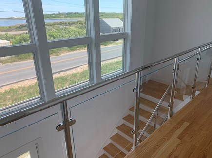 Truro Cape Cod vacation rental - The elegant glass stairway takes you upstairs to the bedrooms/