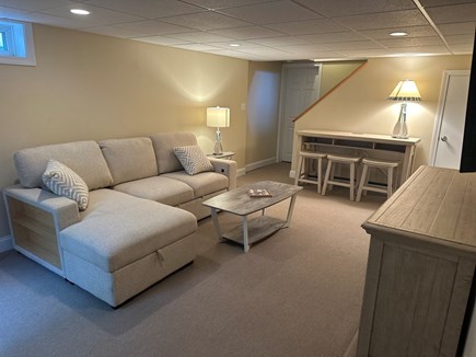 East Falmouth Cape Cod vacation rental - Finished lower lever with big screen and pull<br/>Out sofa