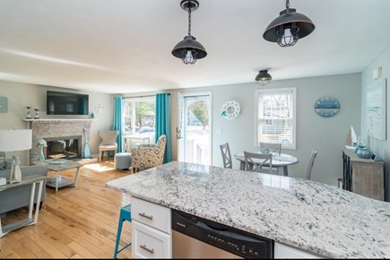 East Falmouth Cape Cod vacation rental - Open kitchen with granite counter seating, small kitchen table