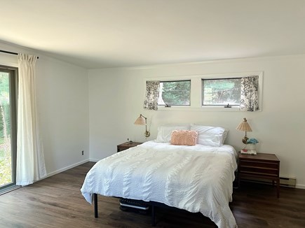 Truro Cape Cod vacation rental - Primary bedroom, queen bed, sliding doors and a smart TV