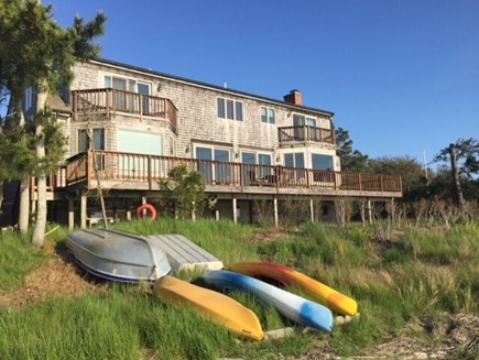 Chatham Cape Cod vacation rental - Backside of the home with open windows facing the water.