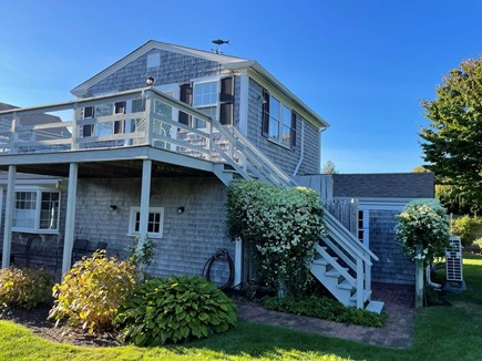 In the Heart of Harwich Port Cape Cod vacation rental - View of deck off the sliders of the suite.