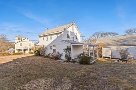 Falmouth Cape Cod vacation rental - Large side yard, and a covered deck with a picnic table!