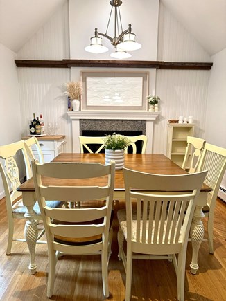 Mashpee Cape Cod vacation rental - Dining area off kitchen w/ gas fireplace for cozy evenings