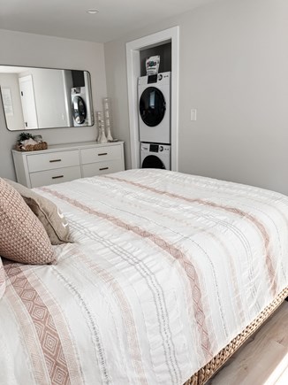 South Yarmouth Cape Cod vacation rental - Queen room 1 - dresser and washer/dryer.