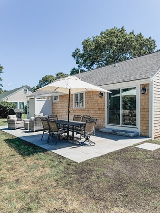South Yarmouth Cape Cod vacation rental - Step outside from the kitchen to dine and relax.