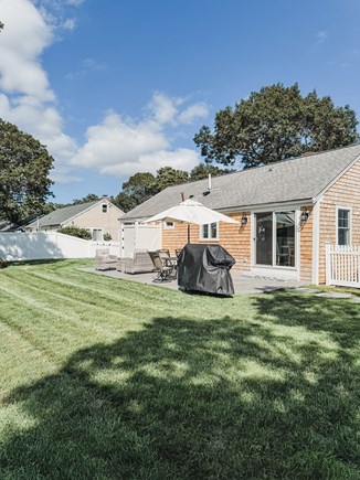 South Yarmouth Cape Cod vacation rental - Private fenced in backyard - living area, grill & outdoor shower.