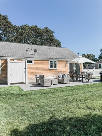 South Yarmouth Cape Cod vacation rental - Step outside from the kitchen to dine and relax.