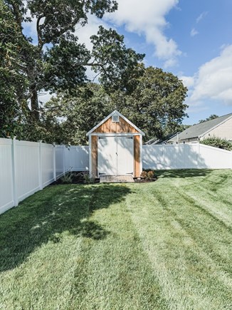 South Yarmouth Cape Cod vacation rental - Backyard- storage shed and lots of yard space.