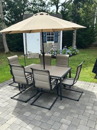 Harwich Cape Cod vacation rental - Shaded dining in the private backyard