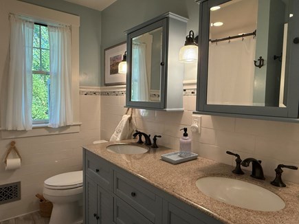 Harwich Cape Cod vacation rental - Bathroom offers two sinks, tub/shower, hair dryer and storage.