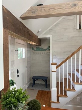 Harwich Cape Cod vacation rental - Entry with bench and hooks