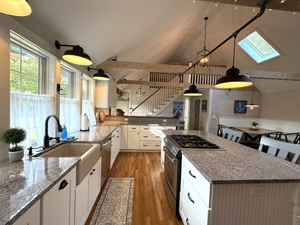 Harwich Cape Cod vacation rental - Enjoy this bright, fully equipped kitchen with island and stools.