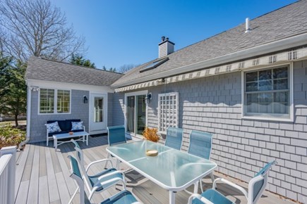 Seconsett Island, Mashpee Cape Cod vacation rental - Spacious deck with awnings, gas grill, and views of Little River.
