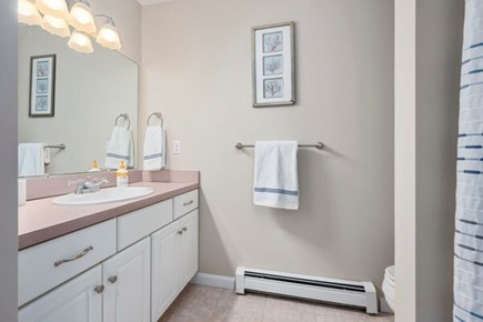 Seconsett Island, Mashpee Cape Cod vacation rental - Full guest bathroom with shower and linen closet.