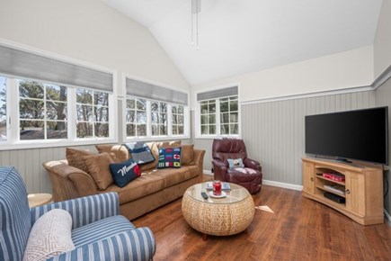 Seconsett Island, Mashpee Cape Cod vacation rental - Cozy TV room with ceiling fan and vaulted ceiling.