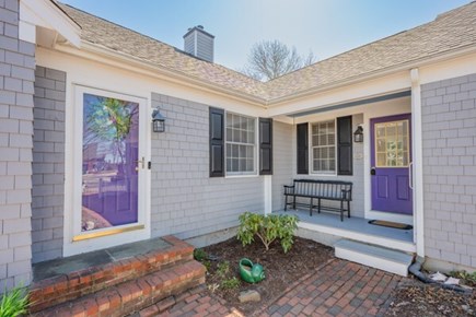 Seconsett Island, Mashpee Cape Cod vacation rental - Front entrance with a screened door and side entrance.