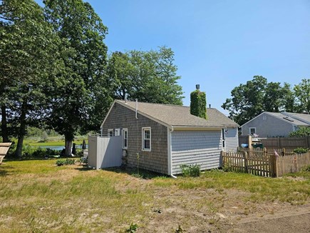 Dennis Cape Cod vacation rental - Back side, overlooking the river showing the outdoor shower.