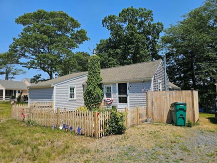 Dennis Cape Cod vacation rental - Front of the cottage with fence in for your fur baby.
