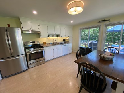 Hyannis - Veteran's Beach Cape Cod vacation rental - Kitchen and dining area with view to deck