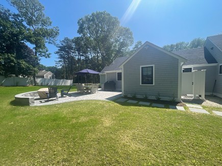 Harwichport Cape Cod vacation rental - Large backyard with patio and outdoor shower