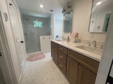 Harwichport Cape Cod vacation rental - Master bath with double sinks, heated floors & walk in shower.