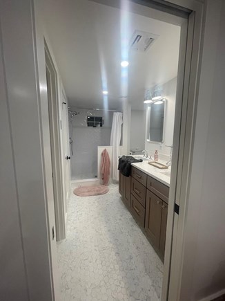 Harwichport Cape Cod vacation rental - Master bath with double sinks, heated floors & walk in shower.