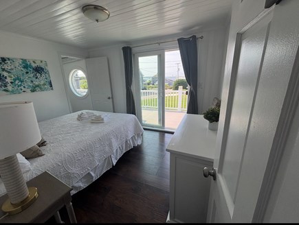 West Yarmouth Cape Cod vacation rental - 2nd FL queen bed Sandy Neck Light w/ slider to balcony