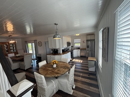 West Yarmouth Cape Cod vacation rental - 1st floor open kitchen with dining and breakfast tables