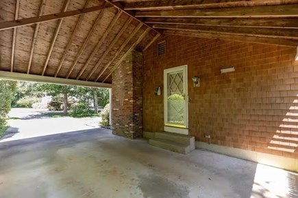 Eastham Cape Cod vacation rental - Covered parking and grill area