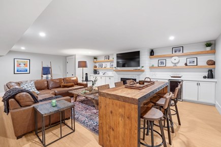 Dennis Cape Cod vacation rental - Lower level den with tv and Shuffleboard