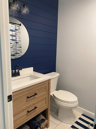 Pocasset Cape Cod vacation rental - Hall bathroom with tub and shower.