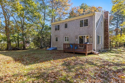 Brewster Cape Cod vacation rental - A spacious backyard, perfect for lawn games and a cozy fire!