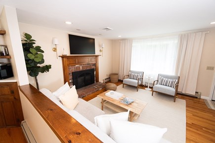 South Yarmouth Cape Cod vacation rental - Living room - gas fireplace, 2 couches, 2 chairs, and ottoman