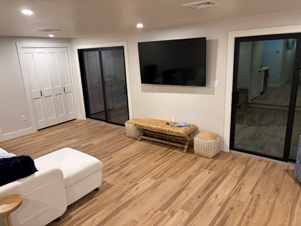 Falmouth Cape Cod vacation rental - Back living area with large smart TV and opens onto back patio