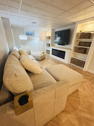 Orleans Cape Cod vacation rental - Movie room with fireplace, oversized Lovesac couch and games!