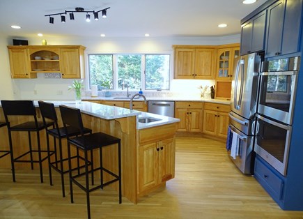 Eastham--Bayside Cape Cod vacation rental - Spacious sunny kitchen area with breakfast bar seating 
