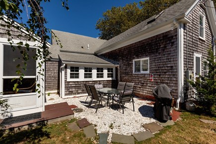 Harwich Cape Cod vacation rental - Relax and dine outdoors on this  crushed-shell patio