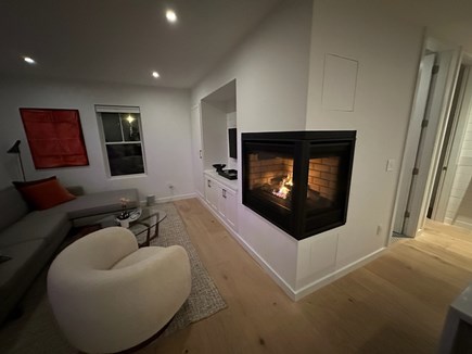 Provincetown Cape Cod vacation rental - Two sided gas fireplace with remote; can also vent heat into unit