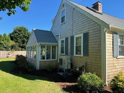 Falmouth Cape Cod vacation rental - Side yard leading to private back yard. Large Beautiful Sun Room.