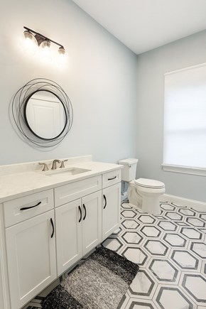 Mashpee Cape Cod vacation rental - Half bathroom -first floor, closet and W/D