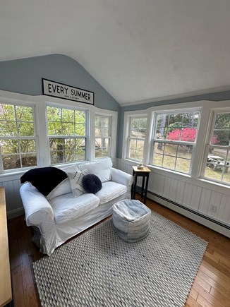 Dennis Cape Cod vacation rental - The sunroom is a bonus with pullout sofa & cozy conversation spot