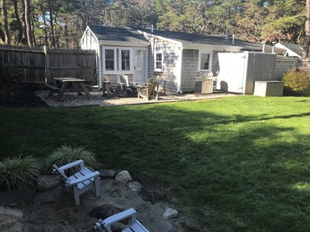 Dennis Cape Cod vacation rental - Fully fenced in yard, large outdoor shower, gas grill, firepit