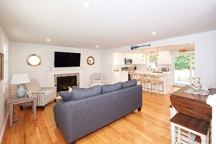 Harwich Cape Cod vacation rental - Living area opens up to kitchen and private back yard.