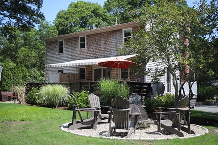 Harwich Cape Cod vacation rental - Spacious deck, electric awning and fire pit.