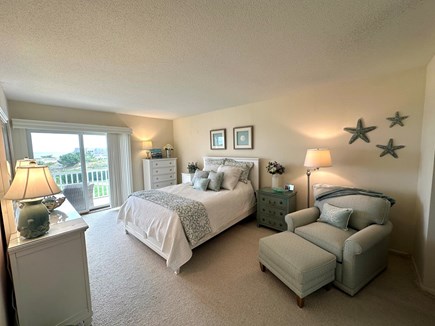 West Harwich Cape Cod vacation rental - Primary bedroom with queen-sized bed and direct access to deck