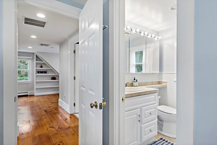 Orleans, Rocky Point Retreat Cape Cod vacation rental - Ensuite bathroom includes a single vanity & glass walk-in shower