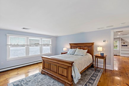 Orleans, Rocky Point Retreat Cape Cod vacation rental - Primary bedroom on the second floor with serene Town Cove views