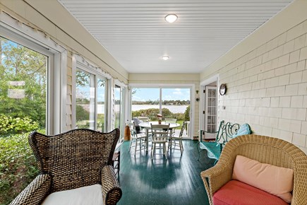 Orleans, Rocky Point Retreat Cape Cod vacation rental - Charming porch with additional seating and dining options