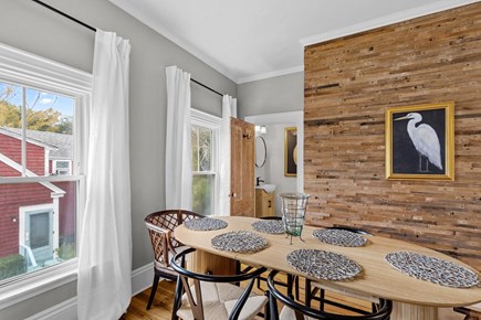 Provincetown Cape Cod vacation rental - The dining space features a modern wood accent wall